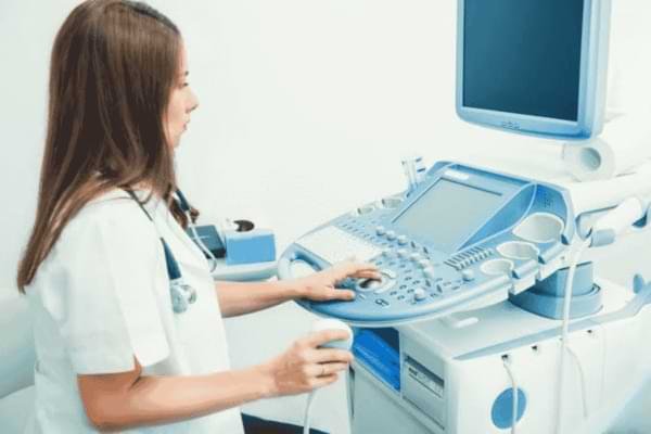 Doctor reviewing pregnancy ultrasound recommendation with patient